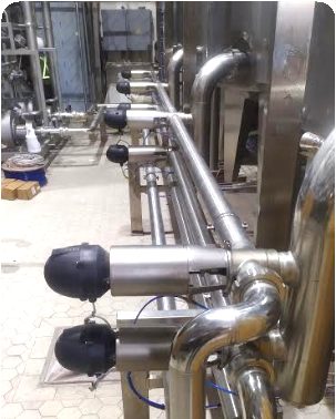 Clean-in-place piping installed in a food and beverage facility