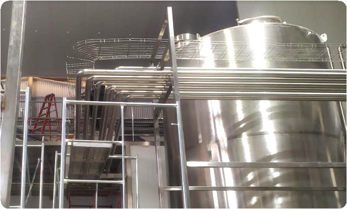 Stainless simple-syrup line installed in a food and beverage facility