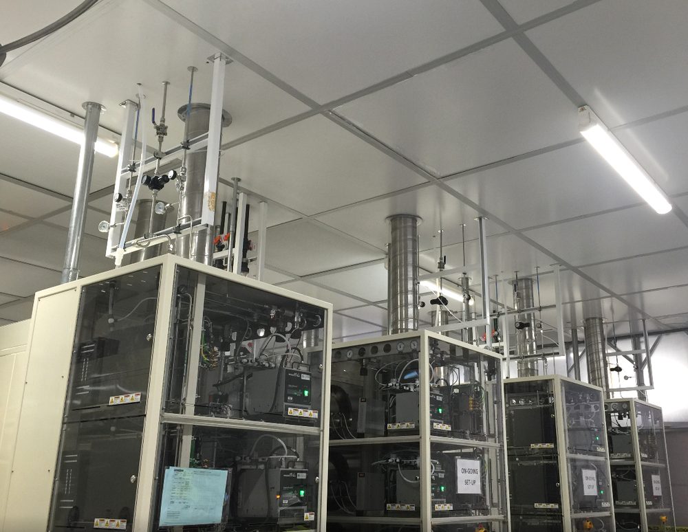 Stainless bulk-gas headers and bellows installed in a semiconductor cleanroom
